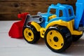 Children toys tractor on wooden background