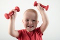 Children train with dumbbells. The concept of sport in the family Royalty Free Stock Photo