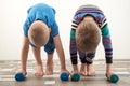 Children train with dumbbells. The concept of sport in the family