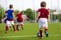 Children Training Soccer on Field. Young Kids Boys kicking Soccer Football Balls on Grass Pitch Royalty Free Stock Photo