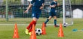 Children Training Soccer on Field. Young Kids Boys kicking Soccer Football Balls on Grass Pitch Royalty Free Stock Photo