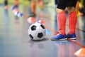 Children training soccer futsal indoor gym. Young boy with soccer ball