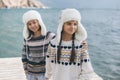 Children travelling in warm wool sweaters and winter hats