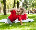 Children twins play on the grass