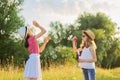 Children two girls blowing soap bubbles. Beautiful natural landscape Royalty Free Stock Photo