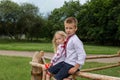 Children in ukrainian traditional clothes on the hedge