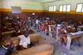 Children in uniforms in primary school classroom listetning to teacher in rural area near Arusha, Tanzania, Africa.