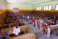 Children in uniforms in primary school classroom listetning to teacher in rural area near Arusha, Tanzania, Africa.