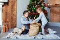 Children unpack gifts for Christmas. The concept of Christmas. Royalty Free Stock Photo