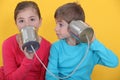 Children using cans as phone