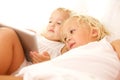 Children using digital tablet on bed Royalty Free Stock Photo