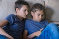 Children using digital tablet computer at home. Technology, online learning, distance education, educational games for Royalty Free Stock Photo