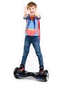 Children using hoverboard, a self-balancing two-wheeled board. Editorial content