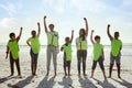 Children, volunteer and beach clean up with friends standing on the sand together for eco friendly conservation. Team