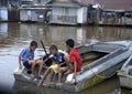 The children waited for the passing merchant`s boat to take a ride to the siring floating market