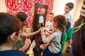 Children learning about plants and oils at a workshop