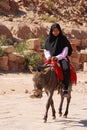 Children waits for tourists for donkey ride