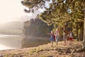 Children Walk By Lake With Parents On Family Hiking Adventure Royalty Free Stock Photo