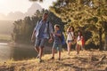 Children Walk By Lake With Parents On Family Hiking Adventure Royalty Free Stock Photo