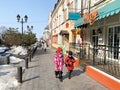 Vladivostok, Russia, March,03,2020. Children walking along Admirala Fokina Street past the Savoy restaurant Royalty Free Stock Photo
