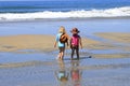 Children walking on beach