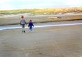 Children walking at beach