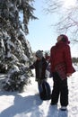 Kids are walking on a street on a nice winter day