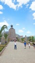 Children walking to the monument to the Middle of the World near of the city of Quito