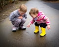 Children watch worm Royalty Free Stock Photo