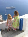 Children watching boats at Oia, Santorini, Greece Royalty Free Stock Photo