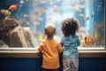 children watching fish at an aquarium Royalty Free Stock Photo