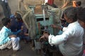 Children watching pictures through a bioscope