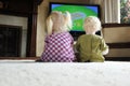 Children watching televison together