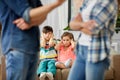 Children watching their parents quarreling at home Royalty Free Stock Photo