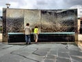 Children by water feature