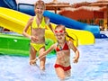 Children on water slide at aquapark. Royalty Free Stock Photo