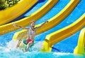 Children on water slide at aquapark. Royalty Free Stock Photo