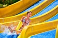 Children on water slide at aquapark Royalty Free Stock Photo