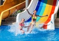 Children on water slide at aquapark. Royalty Free Stock Photo