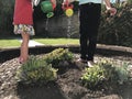 Children Watering the Newly-Planted Plants