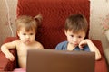 Children wathing cartoons on the notebook Royalty Free Stock Photo