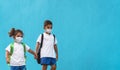 Children wearing face protective mask going back to school during corona virus pandemic Royalty Free Stock Photo