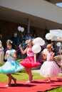 Children with white balloons.