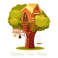 Children wooden house on oak. Tree with ladder and kid tree-house. Royalty Free Stock Photo