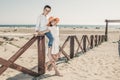 Children on a wooden railing on the seashore Royalty Free Stock Photo