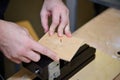 Children work in the training center on wood processing machines. Education in Fablab.