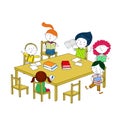 Children write and read, sitting at the table.