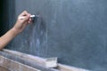Children are writing on the blackboard with Chalk. Royalty Free Stock Photo