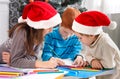 Children writing letter to santa, wait for christmas Royalty Free Stock Photo