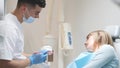 Dentist shows on a mannequin how to brush teeth correctly. Prevention of dental diseases teenagers Royalty Free Stock Photo